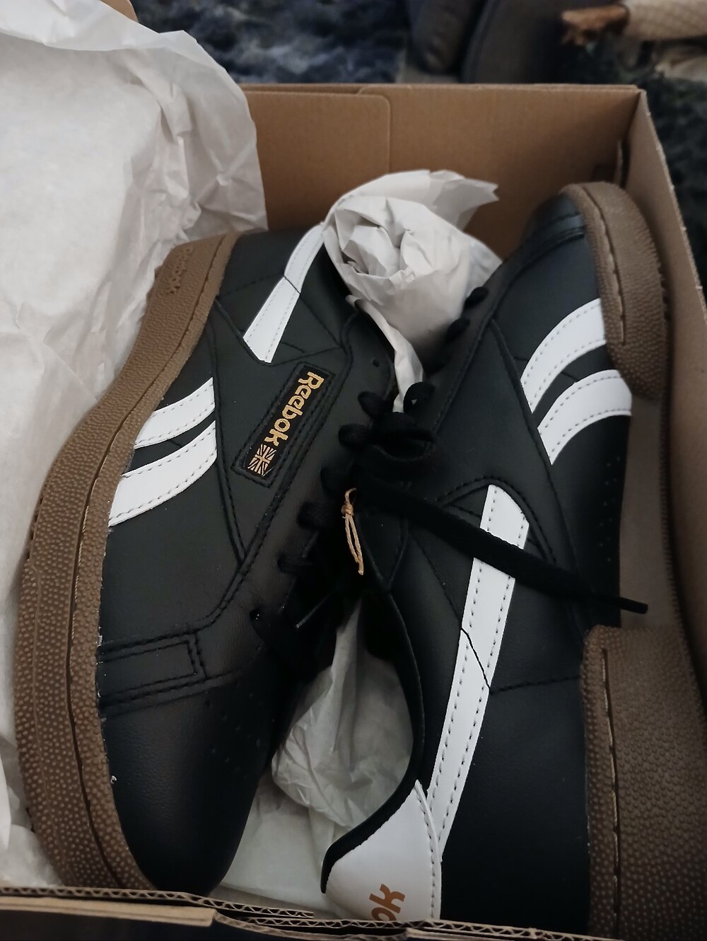 Reebok Black Sneakers with White Stripes and Brown Sole